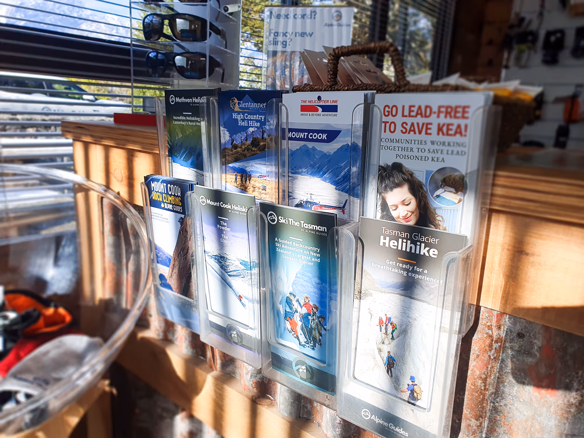 Alpine Guides NZ office brochure stand photo with all brochures we designed for them.