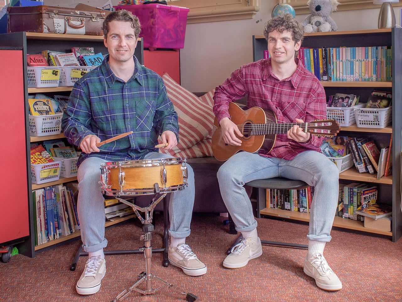 Andrew and Patrick sitting in a school classroom