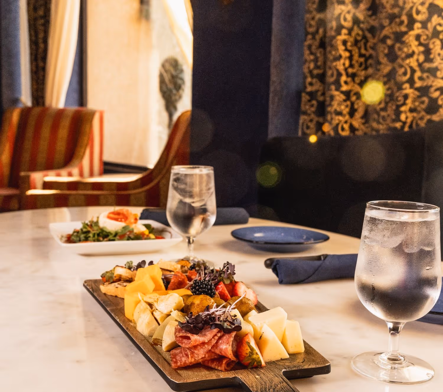 Mezcla restaurant with tables and charcuterie plate