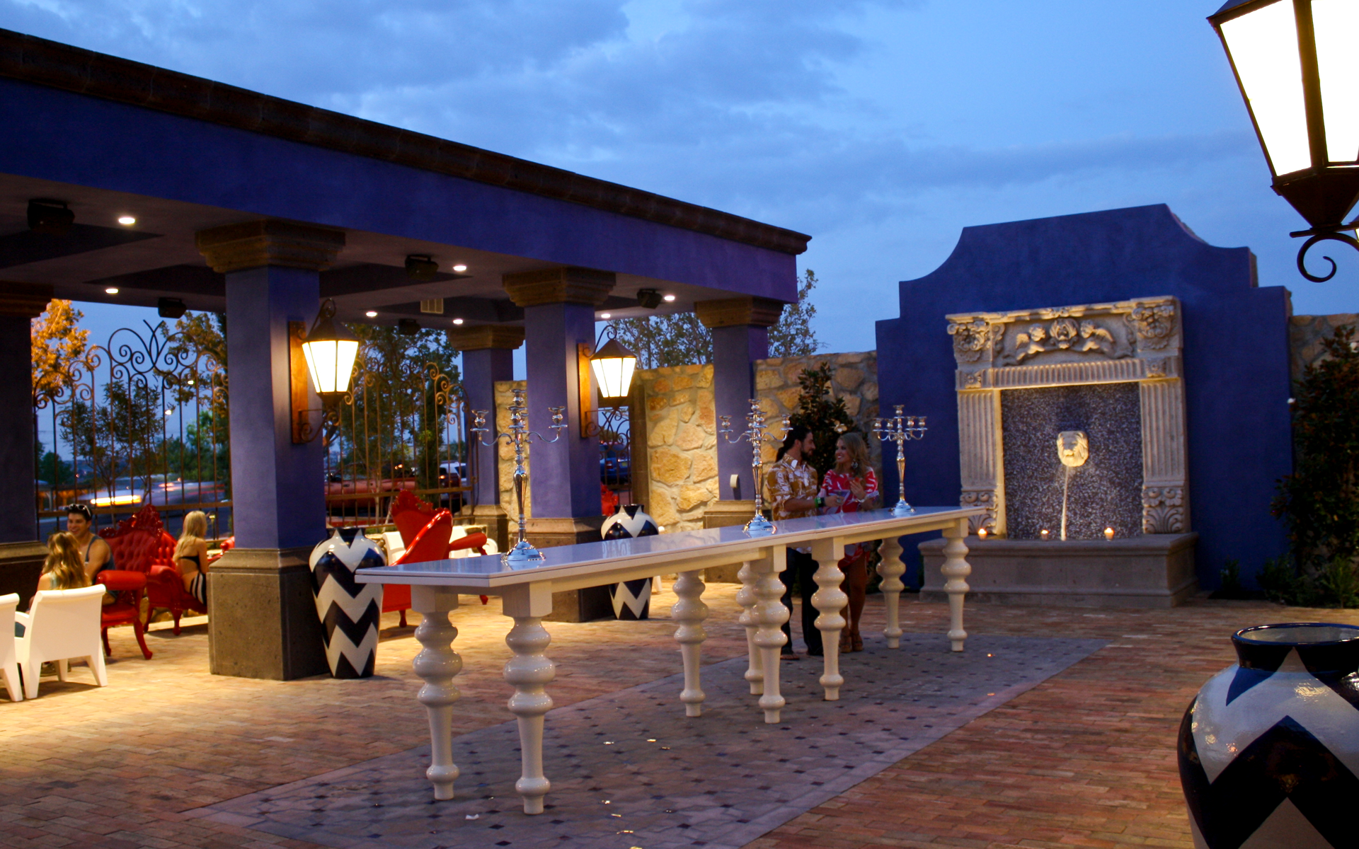 Mezcla patio with large white long table and furniture