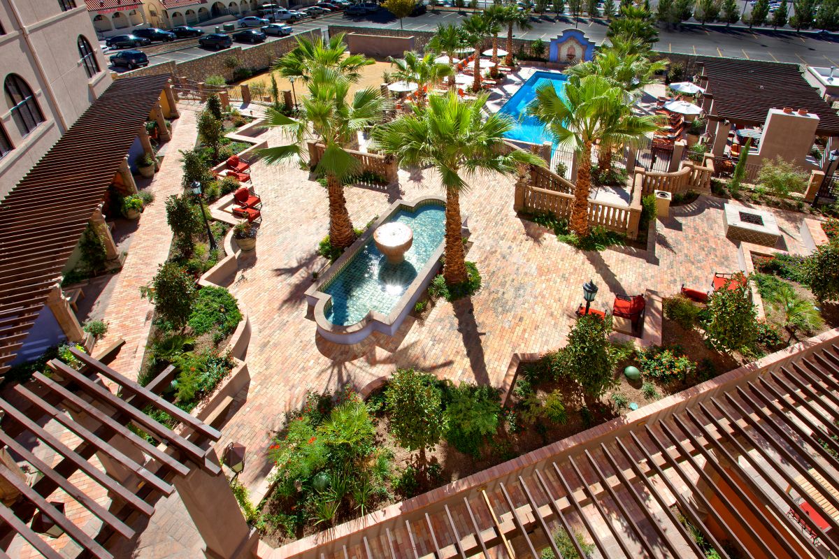 Southwestern courtyard design with pool and fountains
