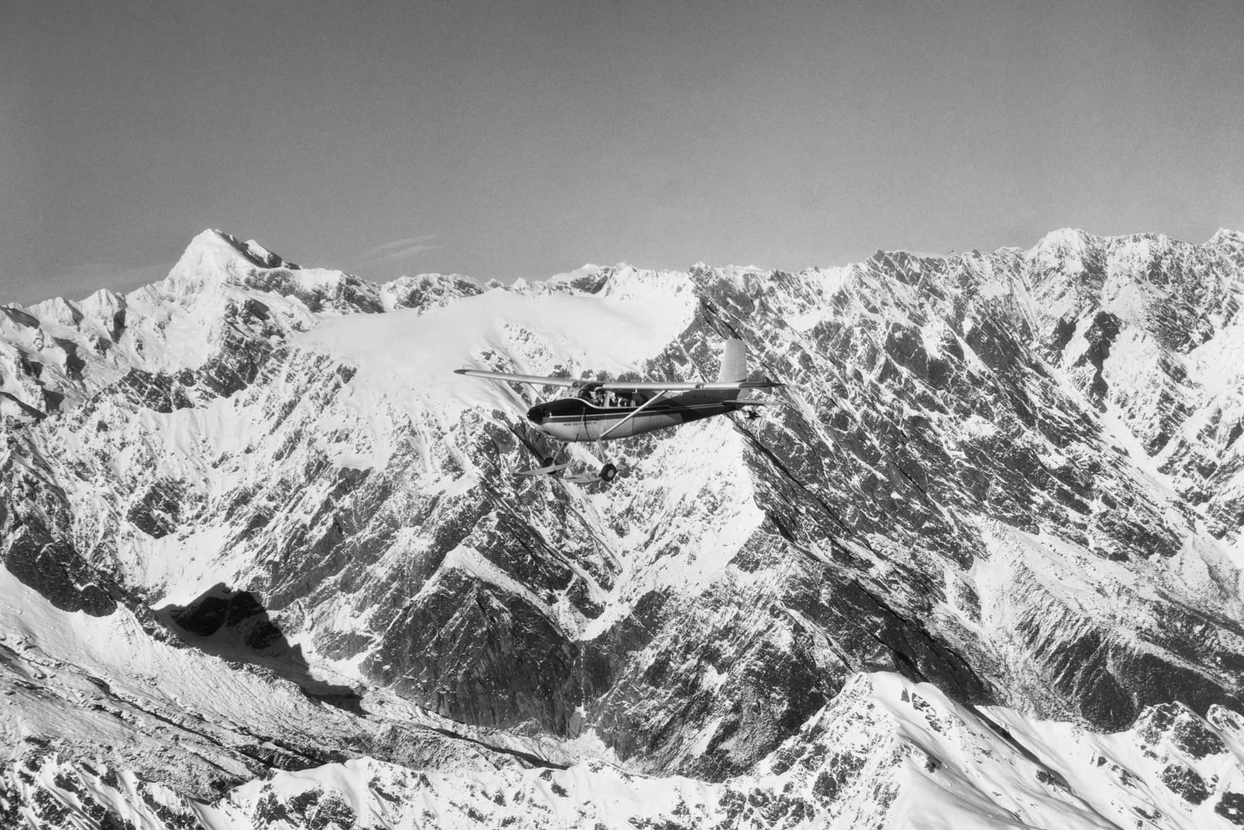 Cessna aircraft over Mt Cook, Fox Glacier, 1960 by Whites Aviation - Medium fine art print