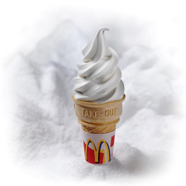 an image of a McDonald's ice cream cone with against a white background. Image is public domain.