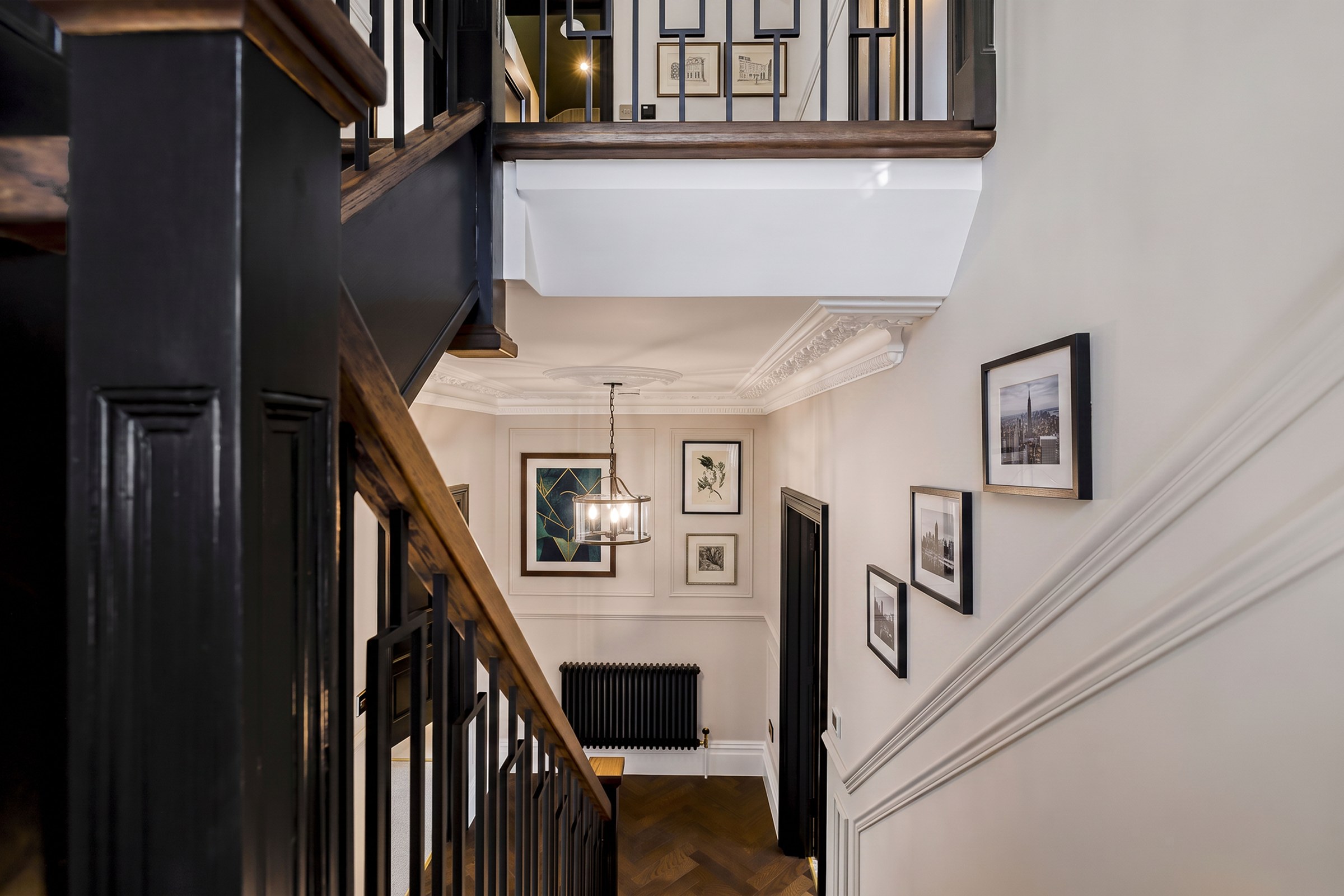 The hallway at Abbeville Village, with herringbone flooring and period joinery