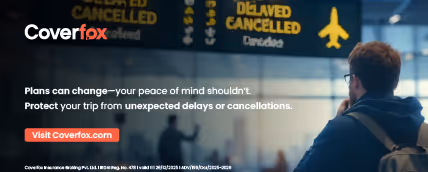 Man looking at airport flight information board displaying delayed and cancelled flights, with Coverfox travel insurance advertisement text.