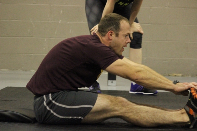 Morgan reaches for his toes