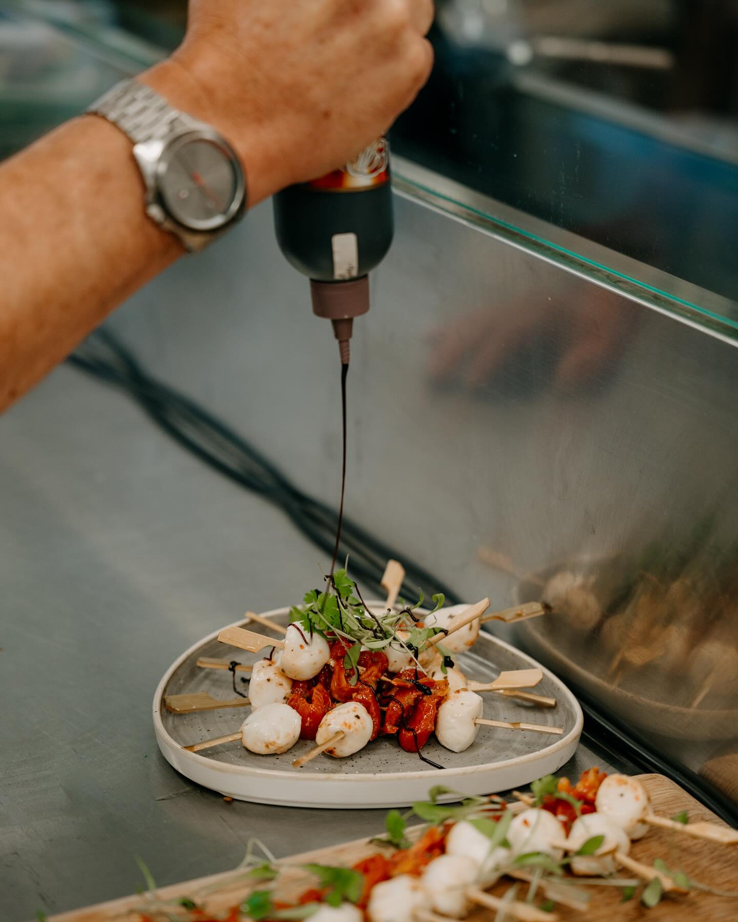 A paella cooks in a giant Paella Pan
