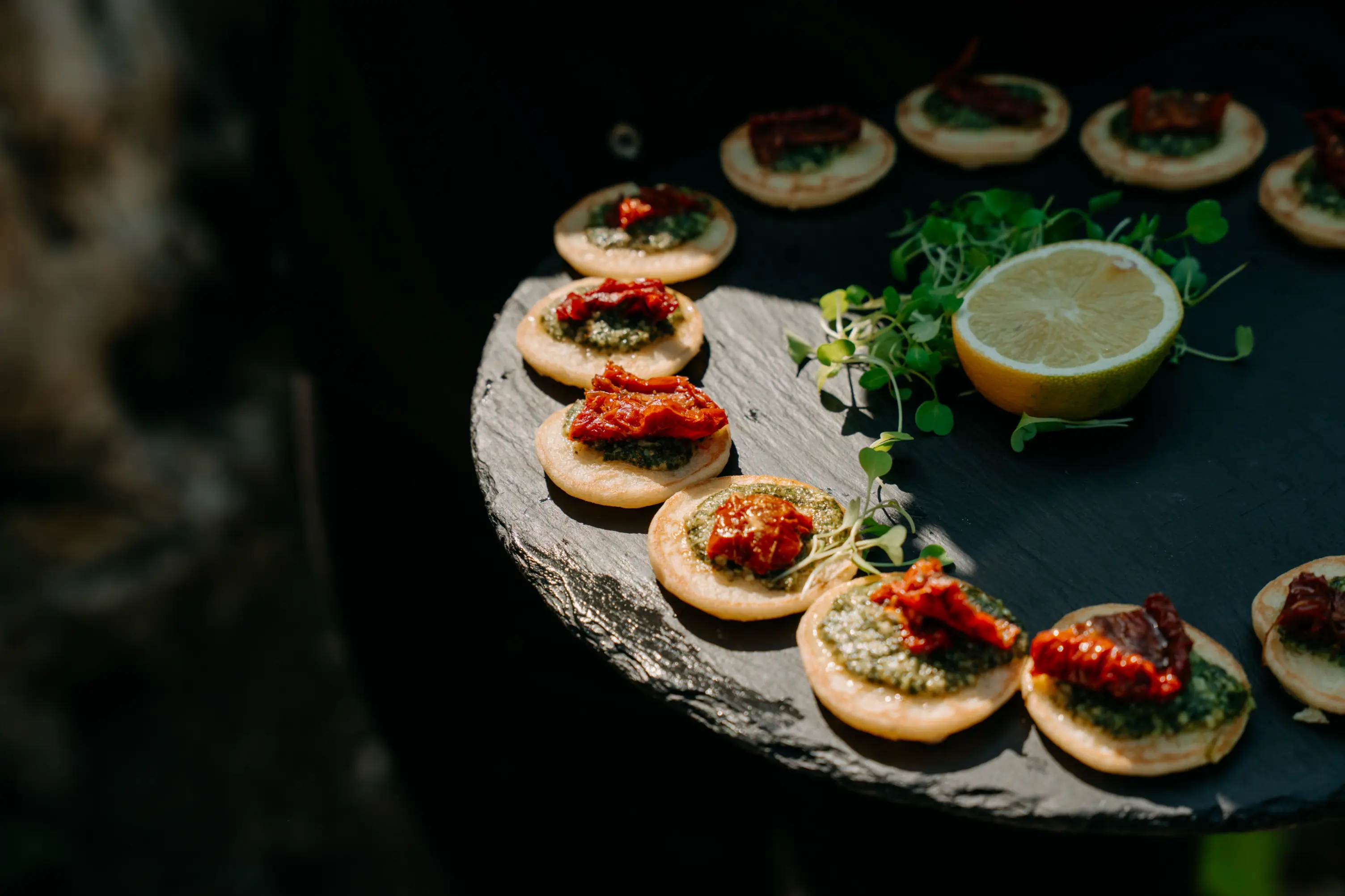 A culinary masterpiece of, seared steak, baby carrots, mashed potatoes, and green beans is served at a catering event in Sussex.