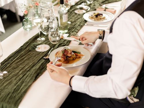 A caterer serving a selection of small delectable deserts at an event in Sussex