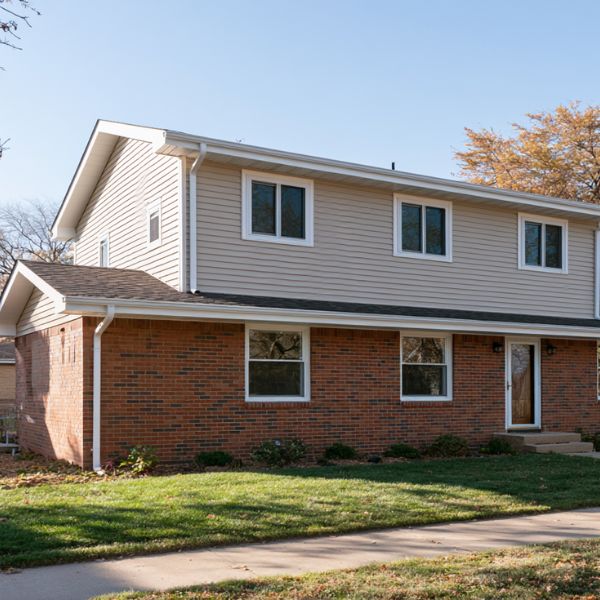 Second floor addition with a mismatched exterior on an Ottawa home