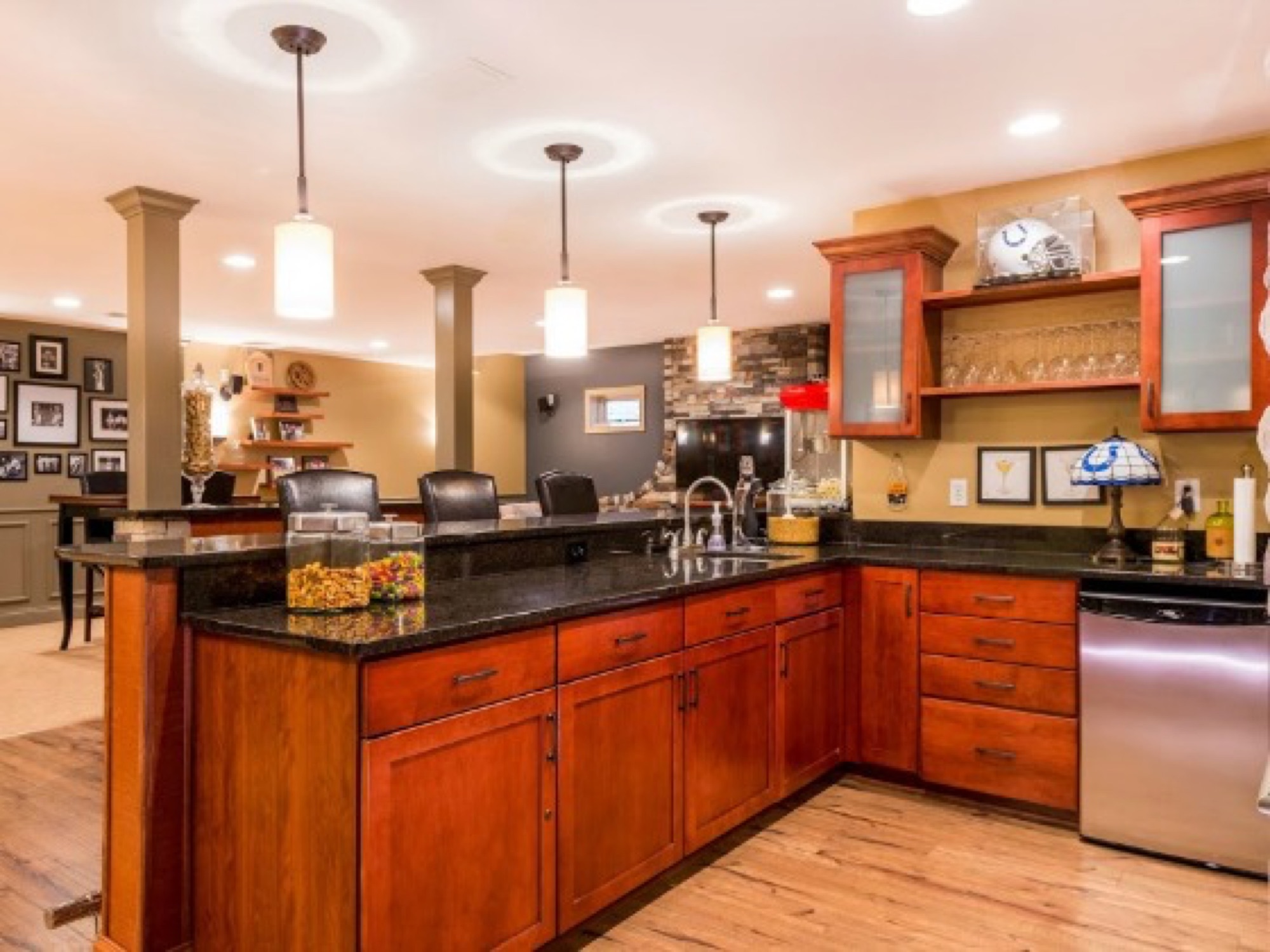 A full basement remodel built around a bar, a games area and a place to watch the game.