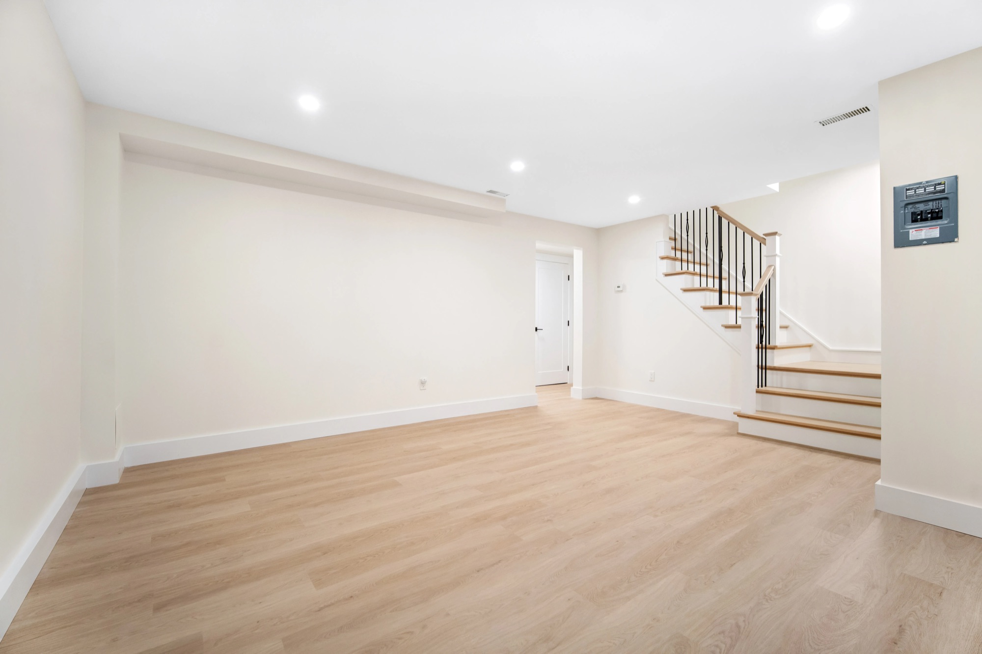 A water-impacted lower level rebuilt with water management built in, plus a rec room, new stairs and a new bathroom.