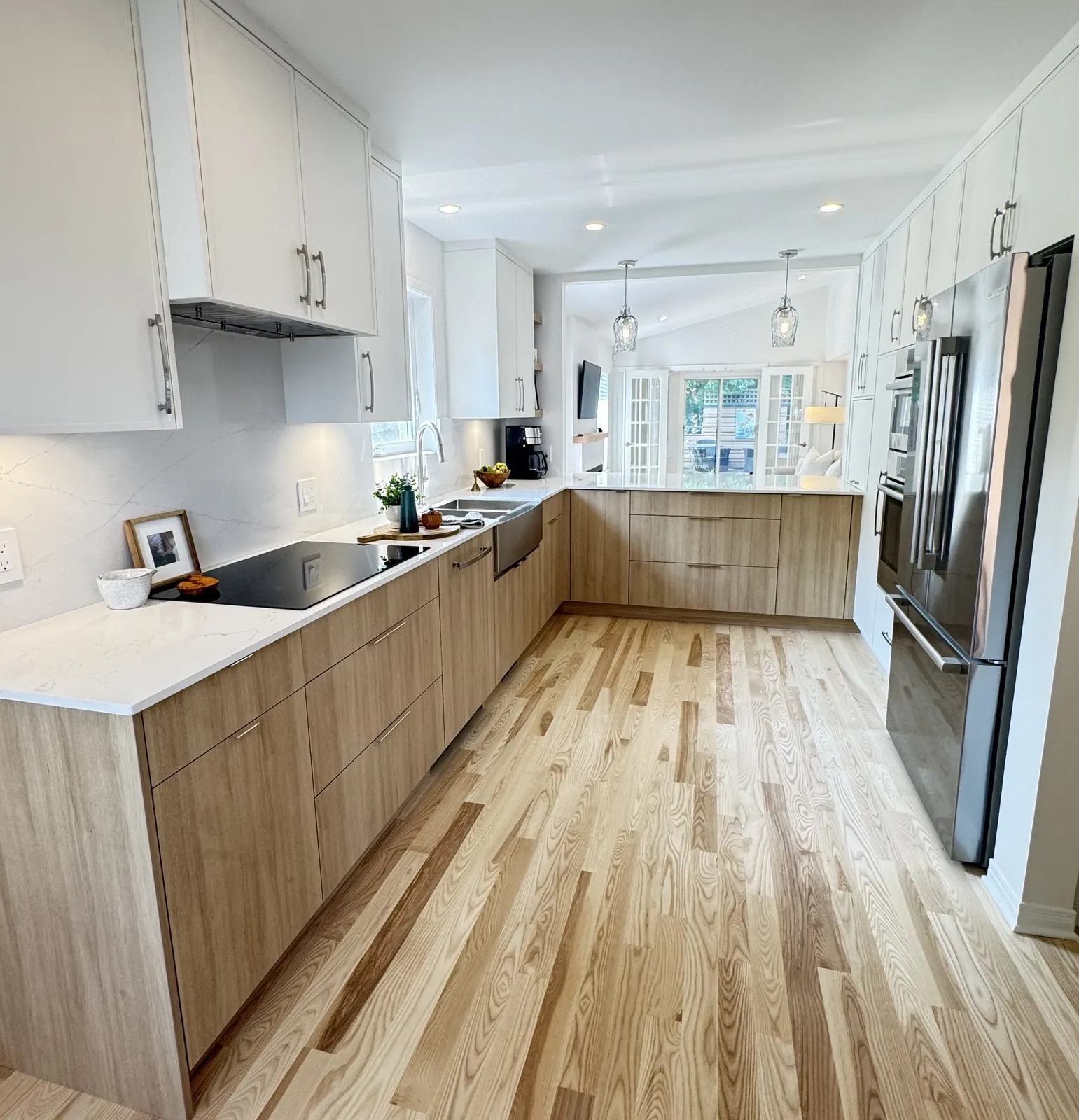A closed-in kitchen in a Revelstoke bungalow moved and opened to the family room, with a new ensuite, wet bar, laundry and finished basement.