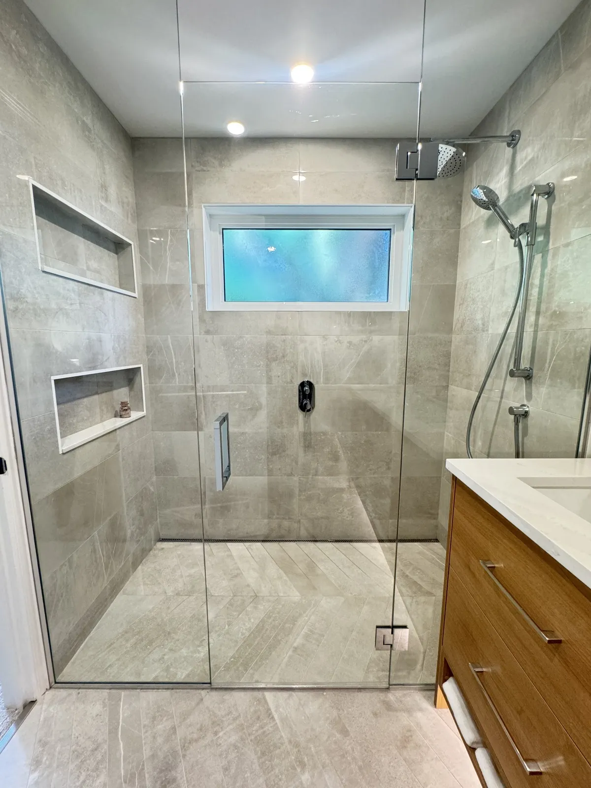 Curbless walk-in shower with linear drain in the primary ensuite