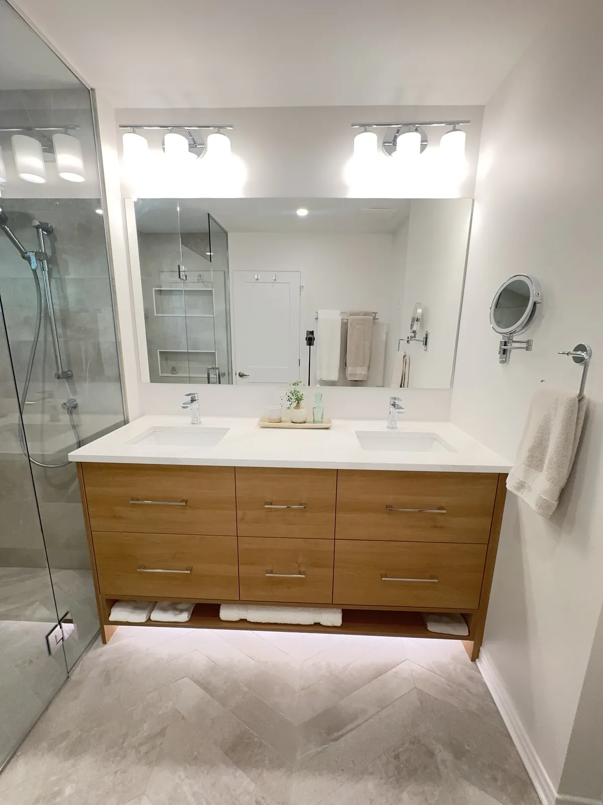 Floating double vanity with under-cabinet lighting in the ensuite