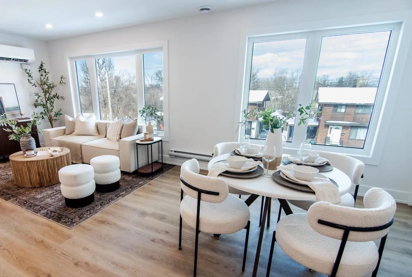 Second-floor unit living and dining room with large windows