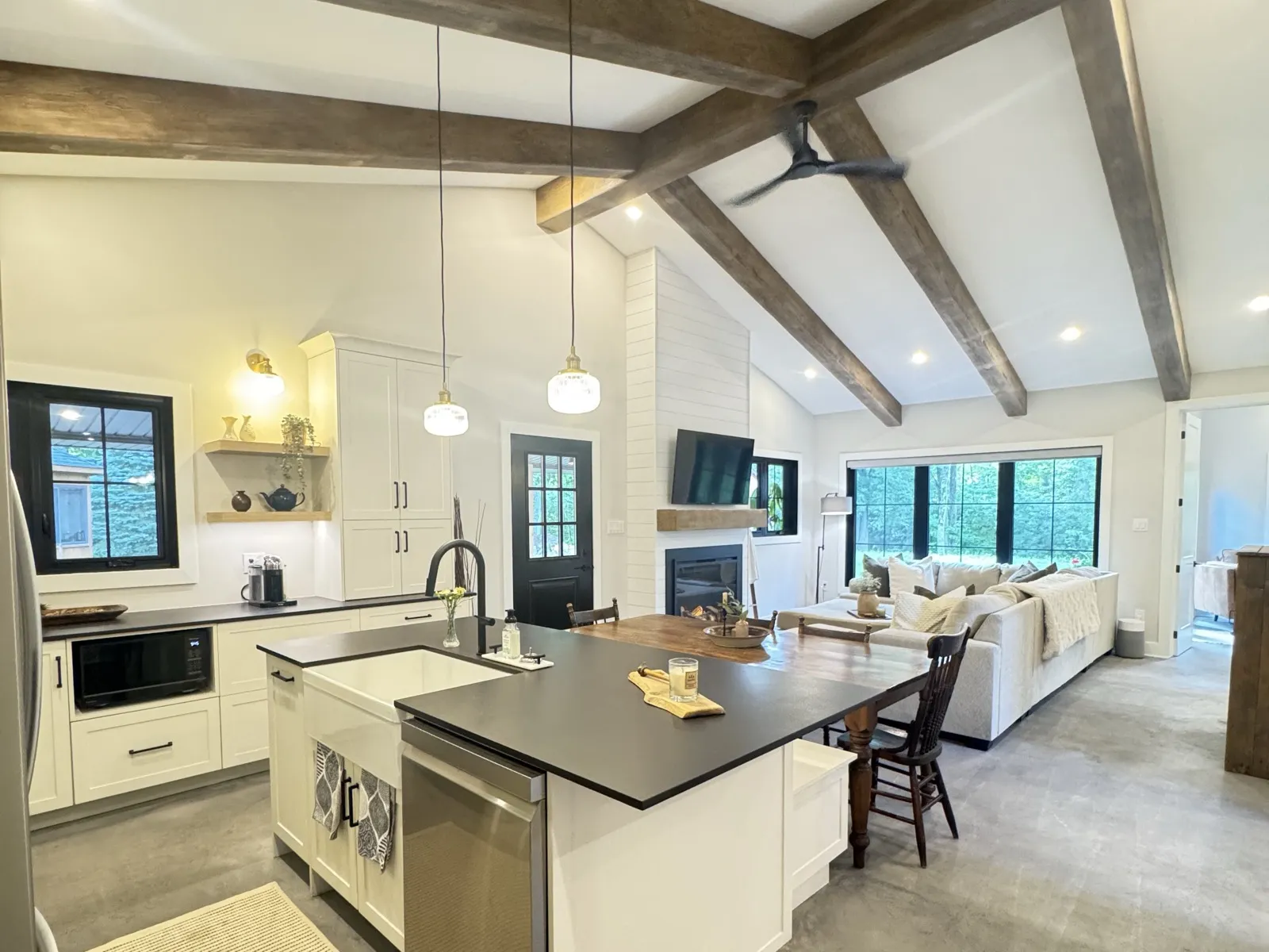 A single-storey, two-bedroom-plus-den home built behind a brick bungalow on a large treed lot in Merivale Gardens, with a vaulted great room, a covered porch and its own septic design.