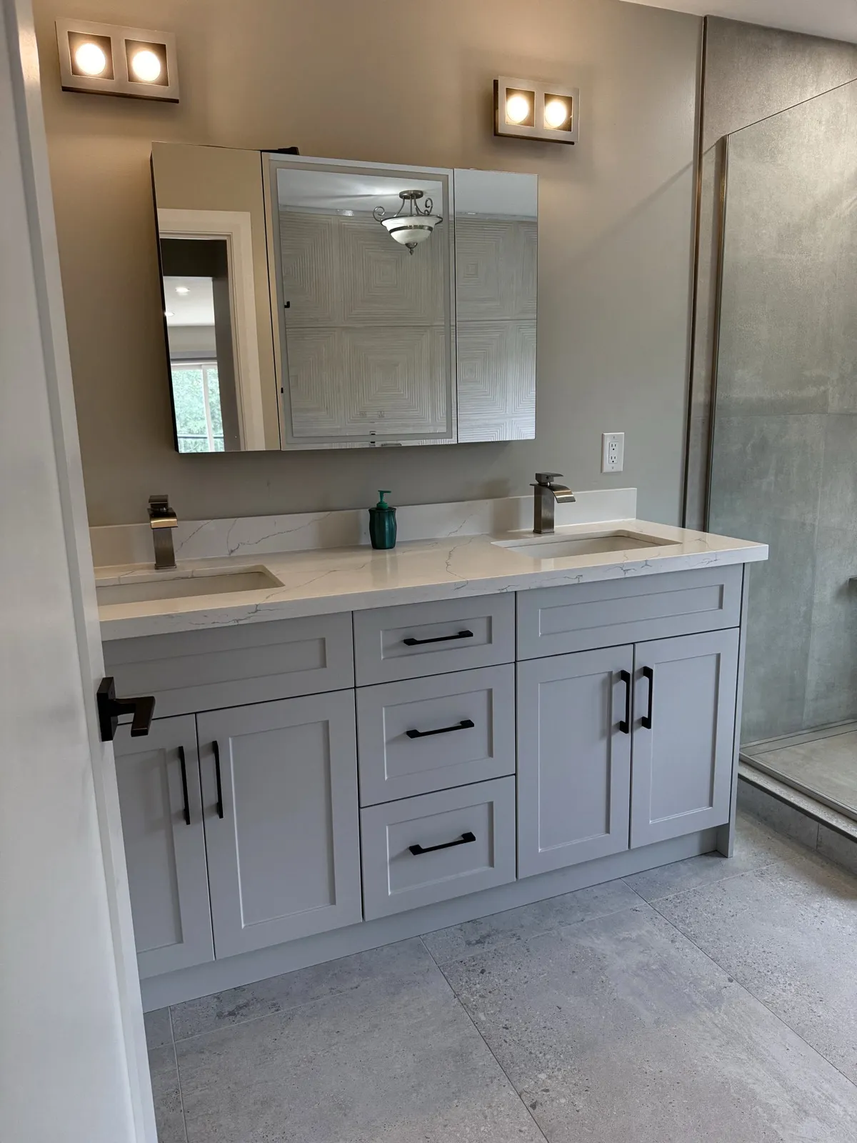 Ensuite double vanity in grey Shaker cabinetry with quartz counter