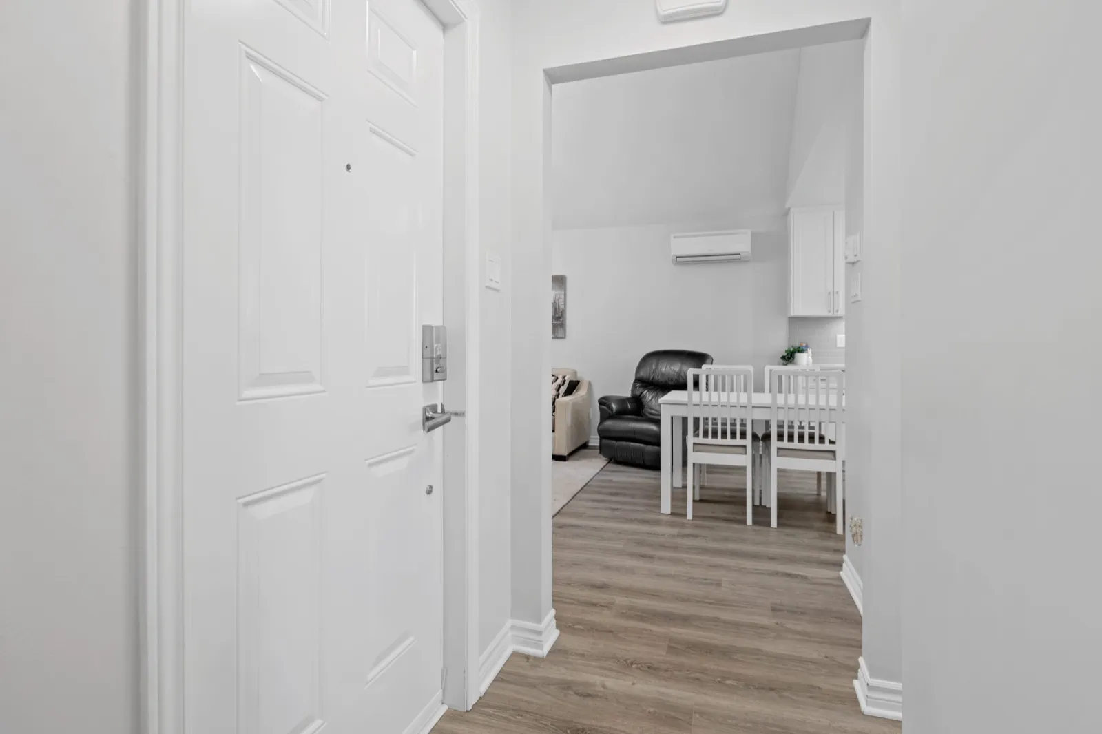 Front entry hall opening into the coach house living and dining room