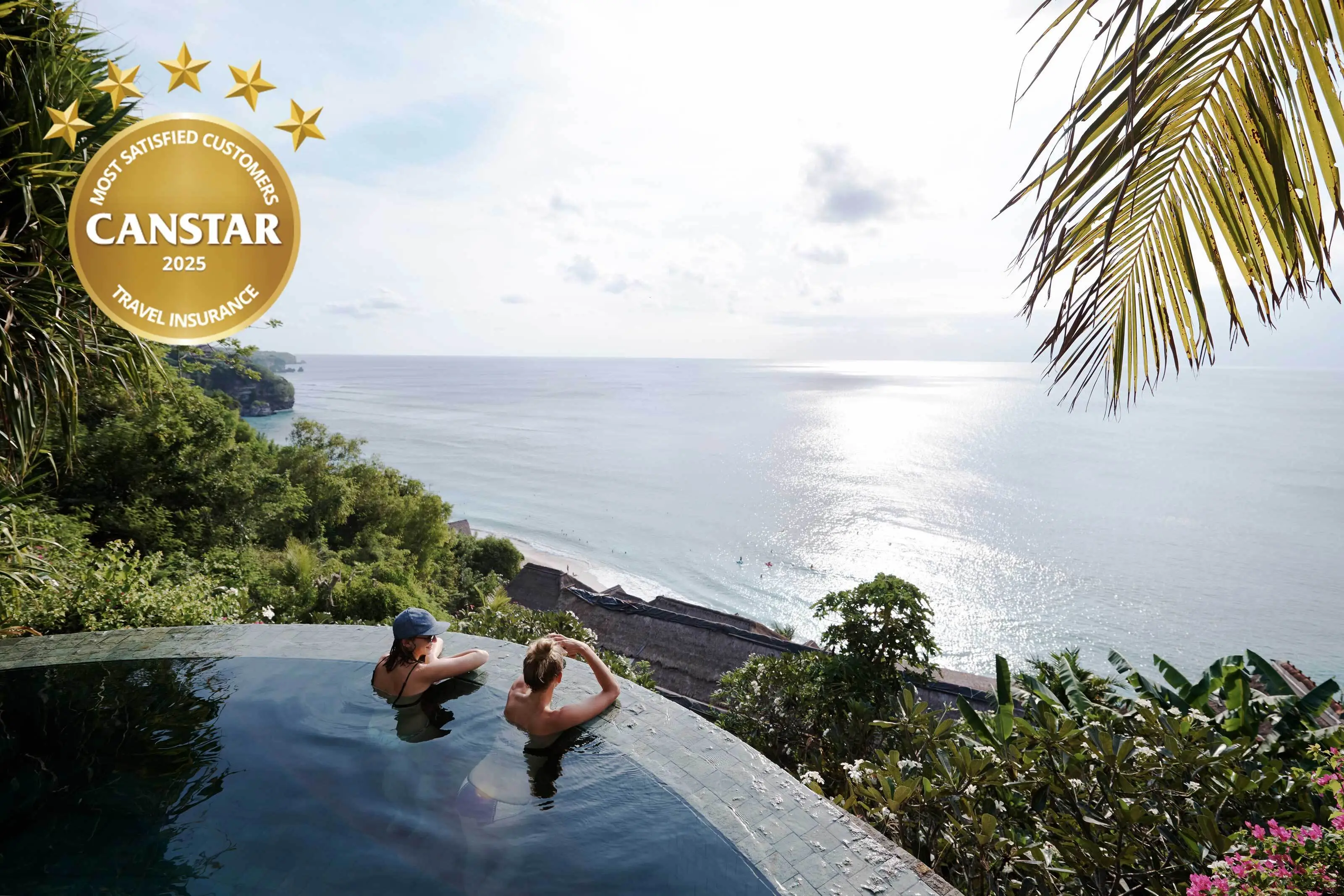 A busy beach with turquoise water and rocky cliffs, overlaid with text offering up to 20% off freely travel insurance.