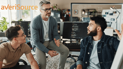 3 employees discussing legacy modernization