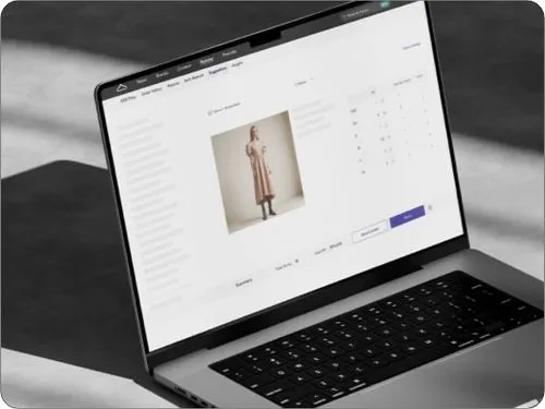 Laptop displaying a product page with an image of a woman in a beige trench coat and product options on a white background.