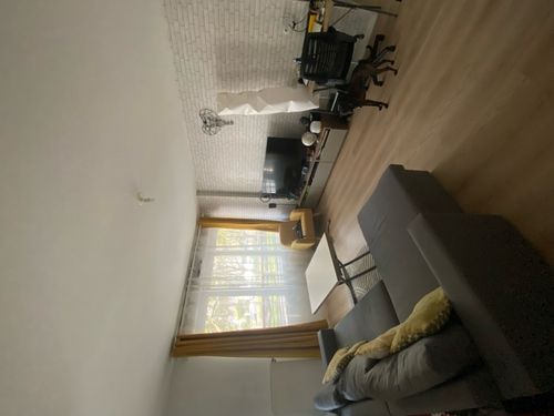 A living room with a couch and a table.