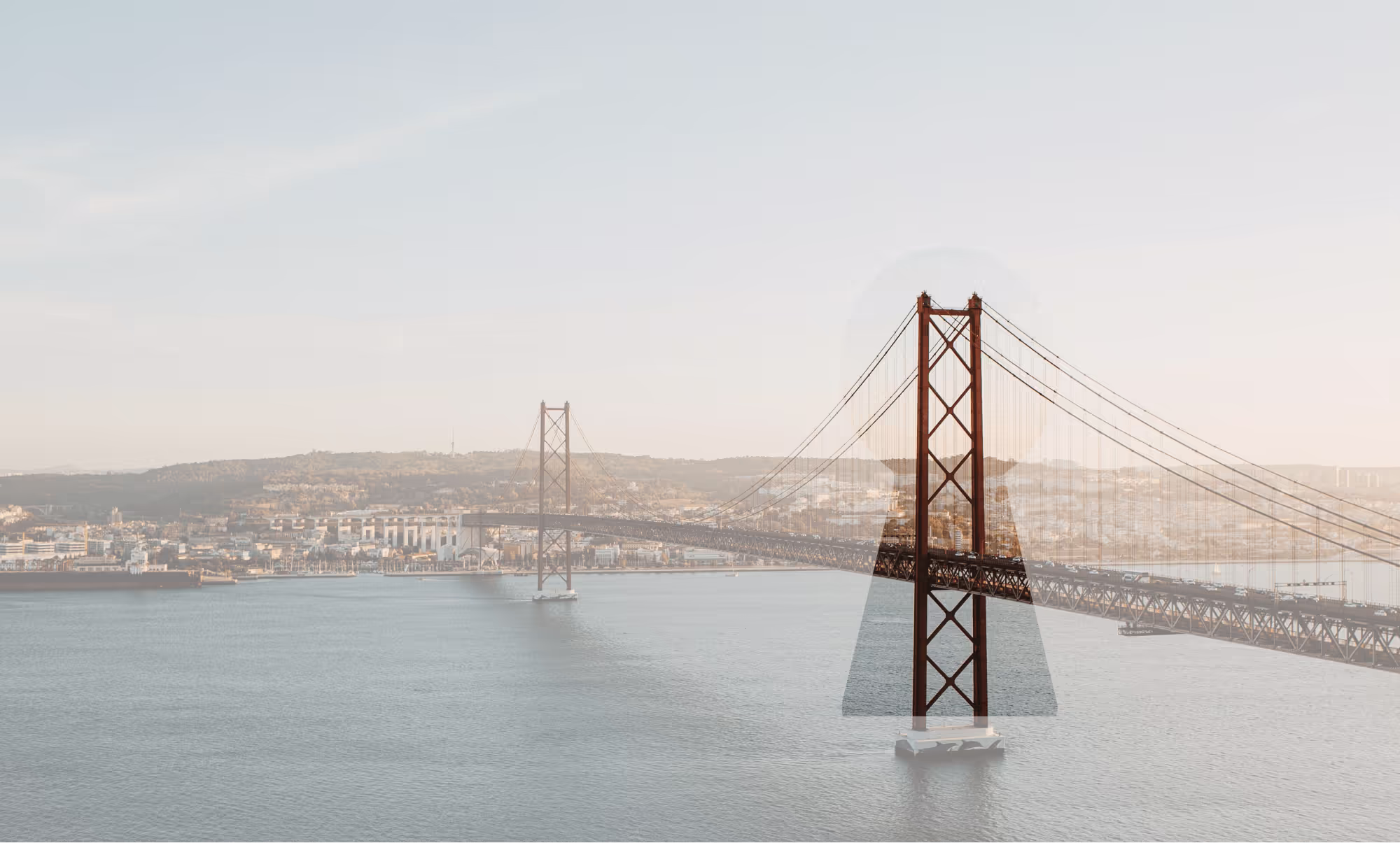25 April Bridge in Lisbon. The image has a filter on top with a keyhole shaped hole around one of the pillars of the bridge