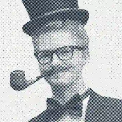 Photo of Andy Przystanski wearing a top hat, and looking extremely elegant.