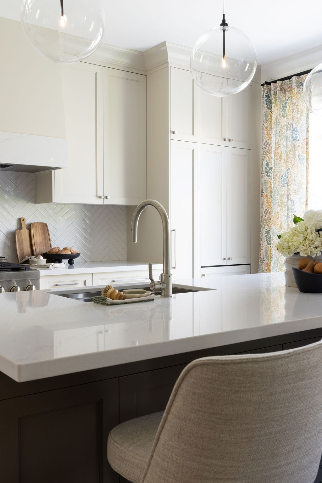 warm neutral kitchen with dark island
