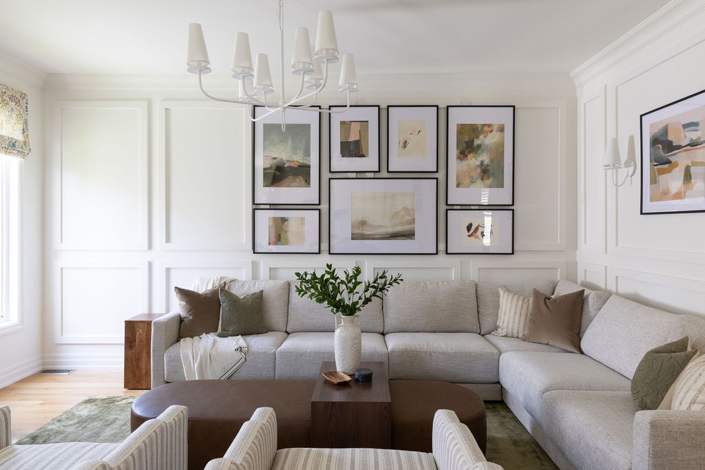 large sectional sofa, gallery wall, unique lighting, custom ottoman