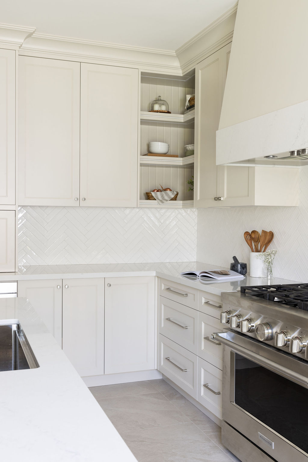 open kitchen shelving, custom range hood, neutral warm kitchen