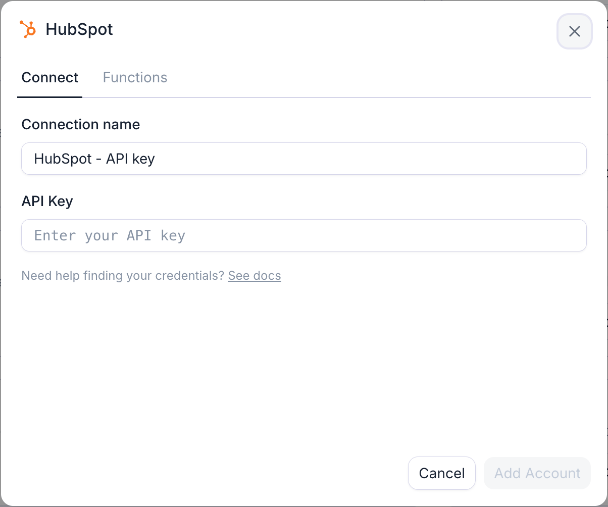 The HubSpot connection dialog: paste the private app access token as the API key.