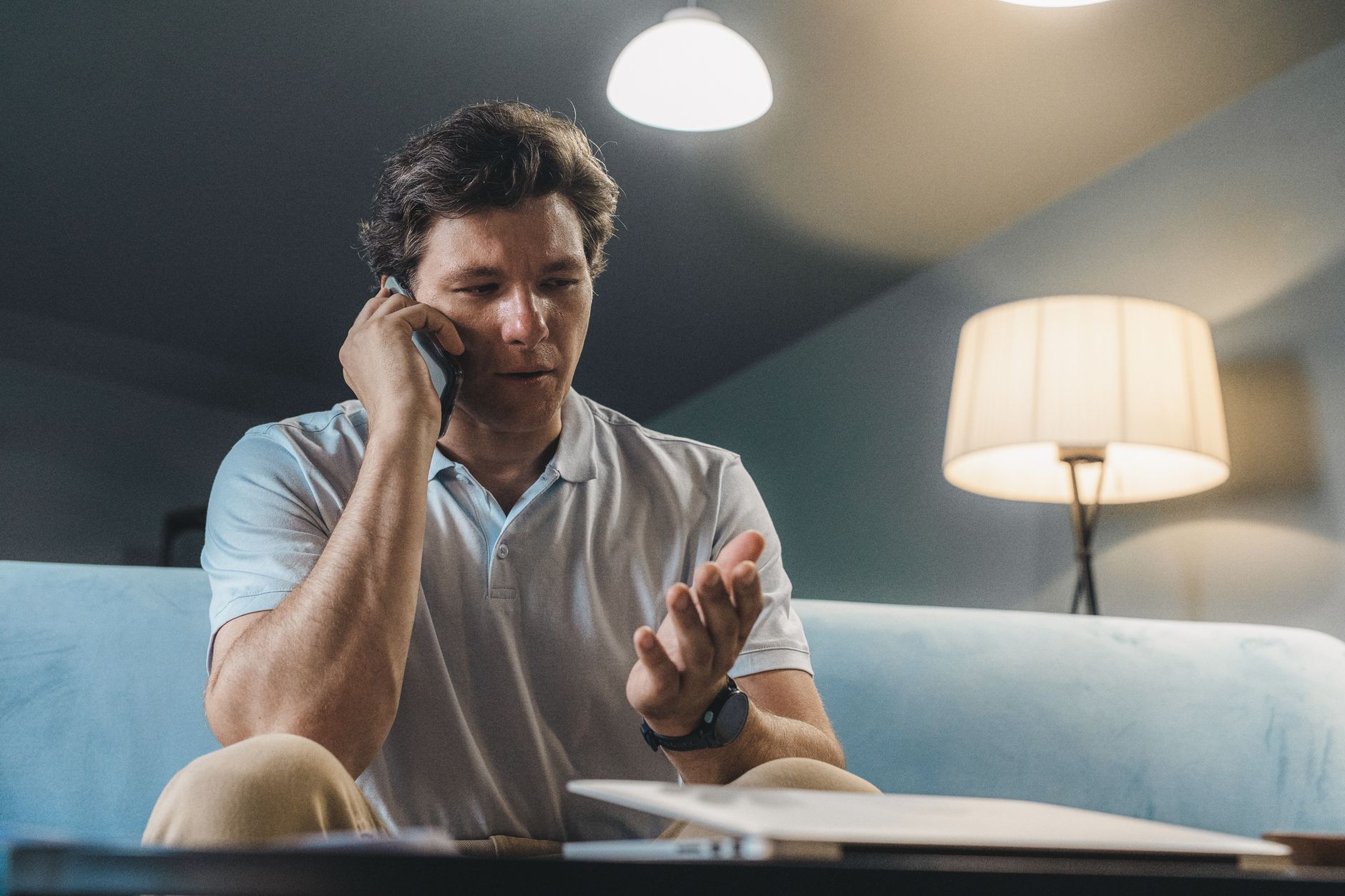 Customer making a phone call at home late in the evening