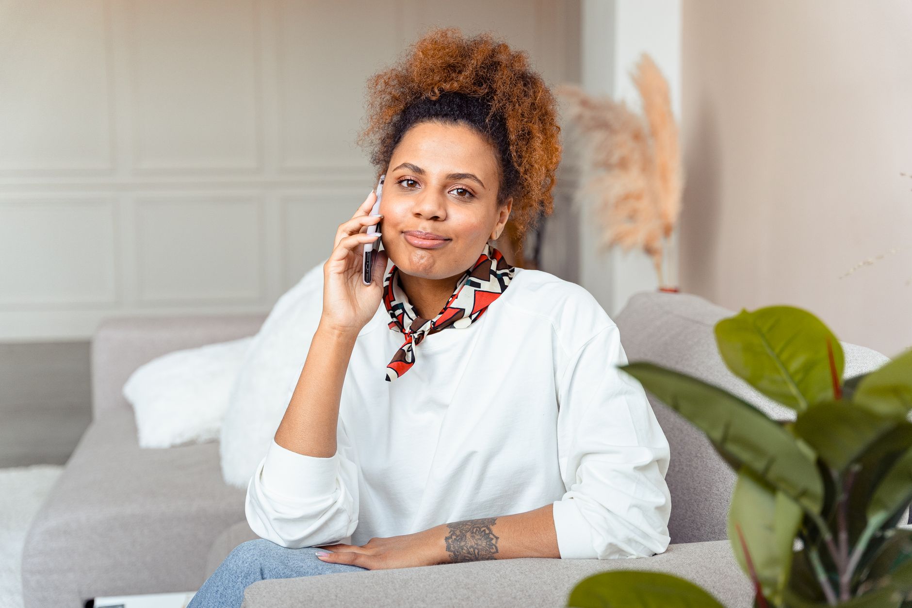 Homeowner answering a phone call at home