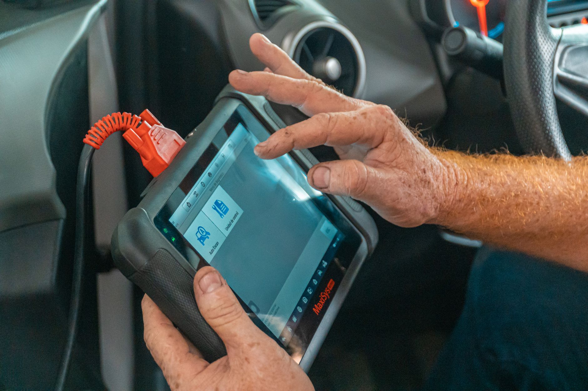 Diagnostic scan tool connected to a car