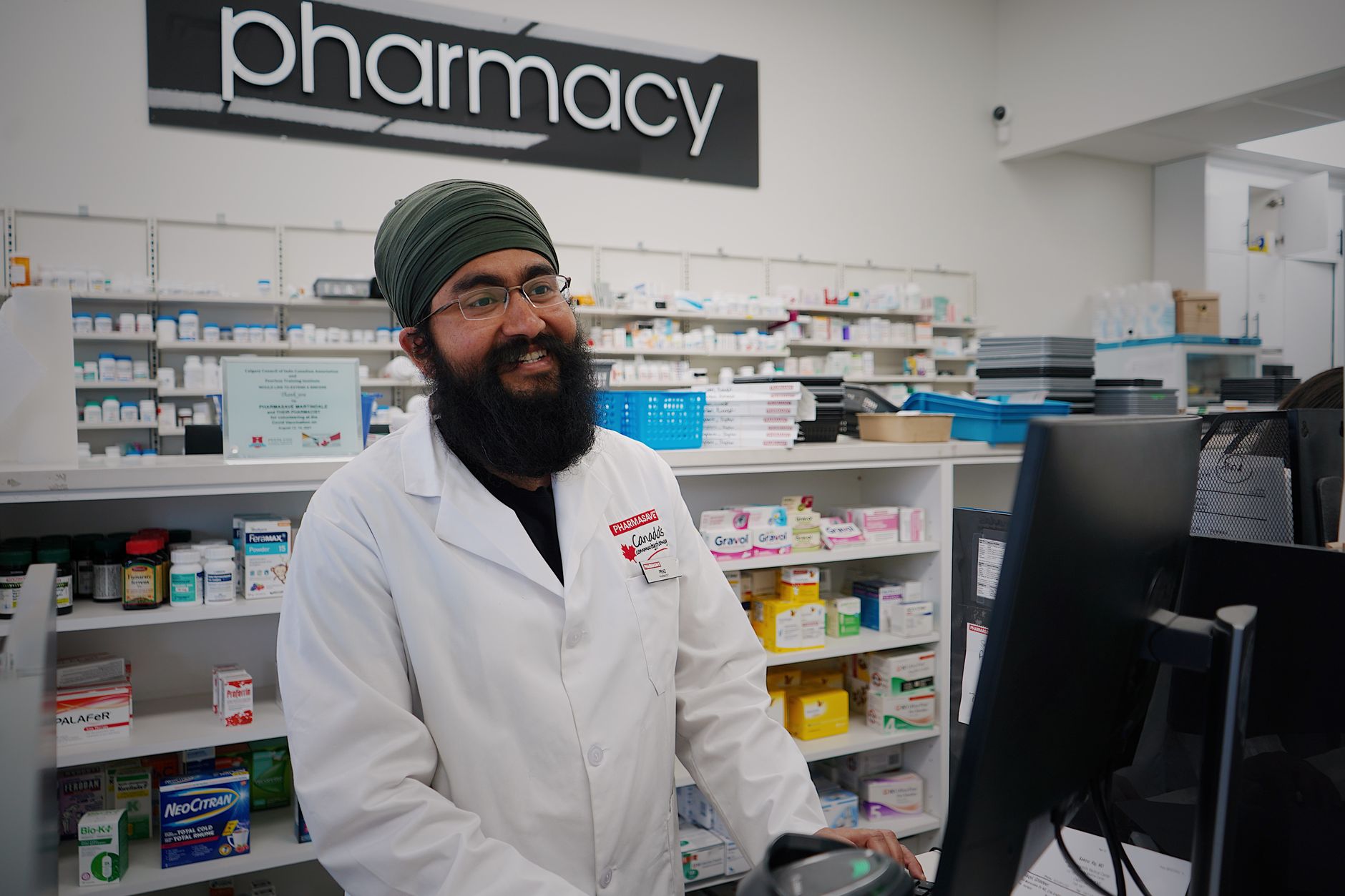 Pharmacist at the pharmacy counter