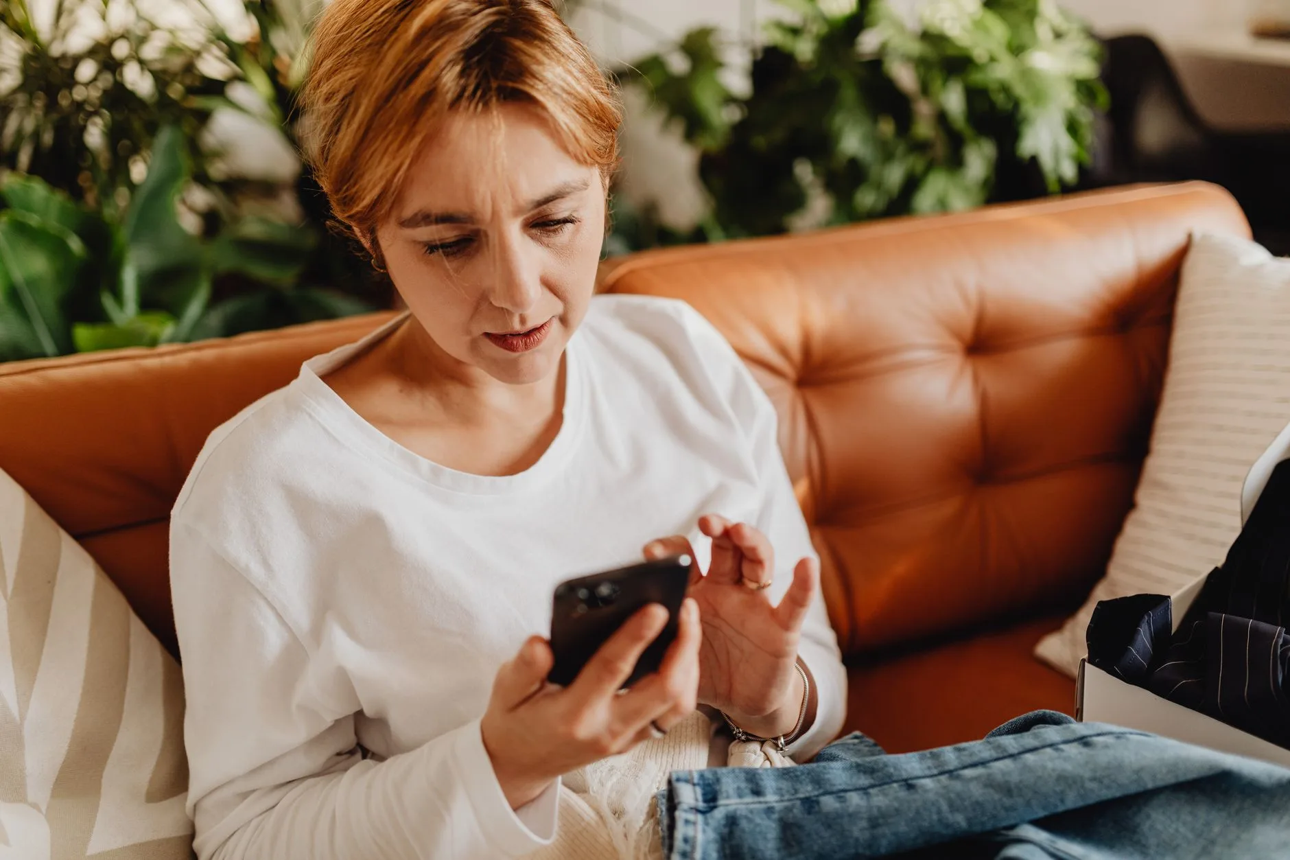 Woman on her phone right after opting in on an ad