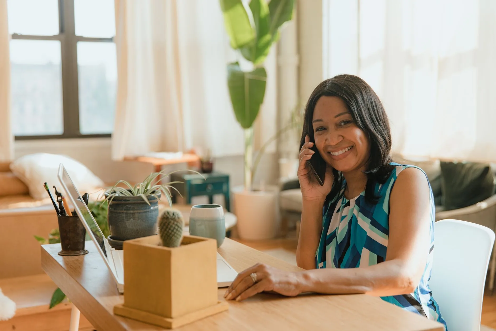 Business owner taking a call at her desk