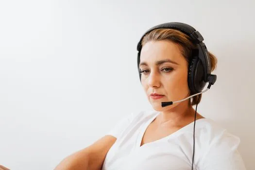 Support agent with a headset finishing a customer call