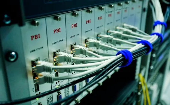 Phone system hardware with patch cables in a rack