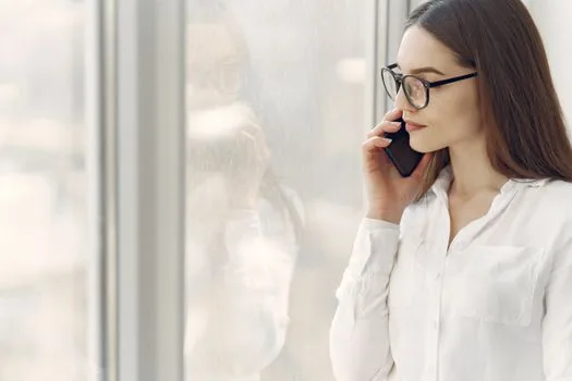 Caller listening to a message before being connected