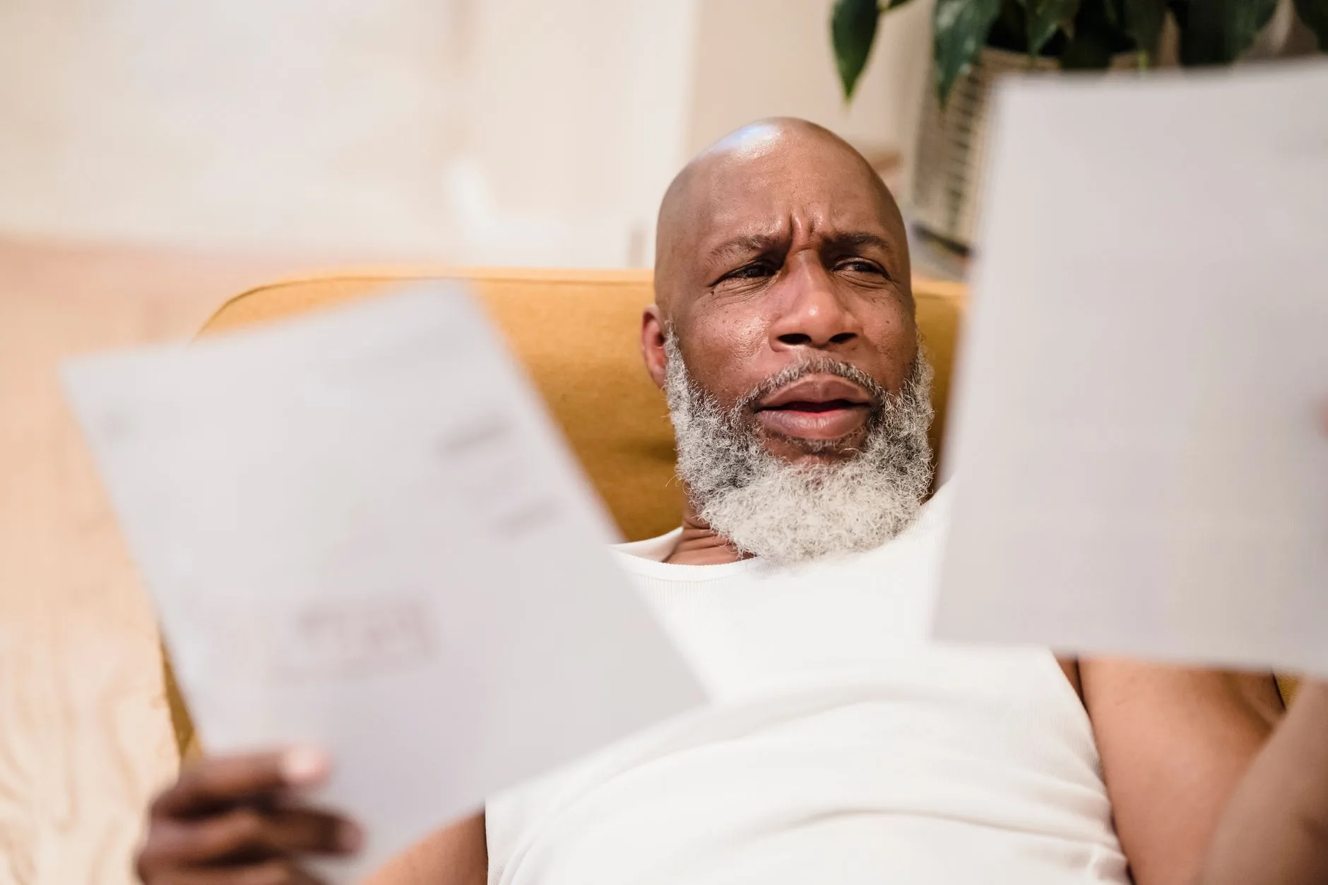 Man reviewing household bills at home