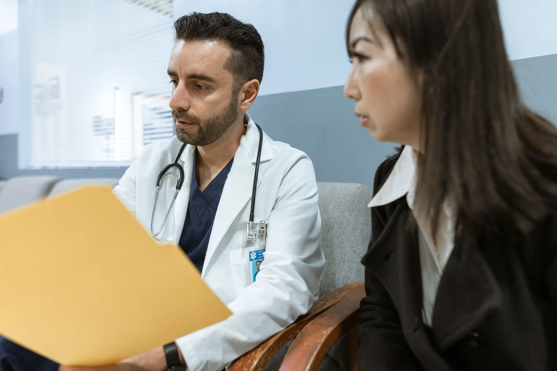 Clinician reviewing records with a patient