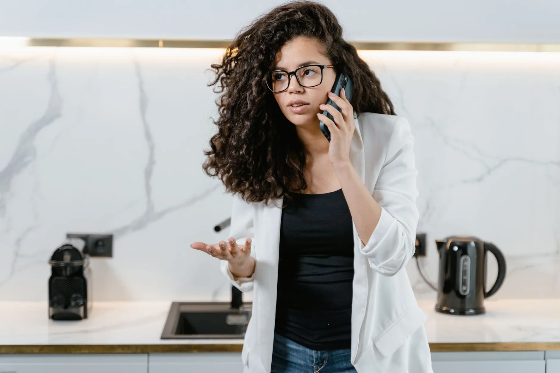 Homeowner on a phone call in her kitchen