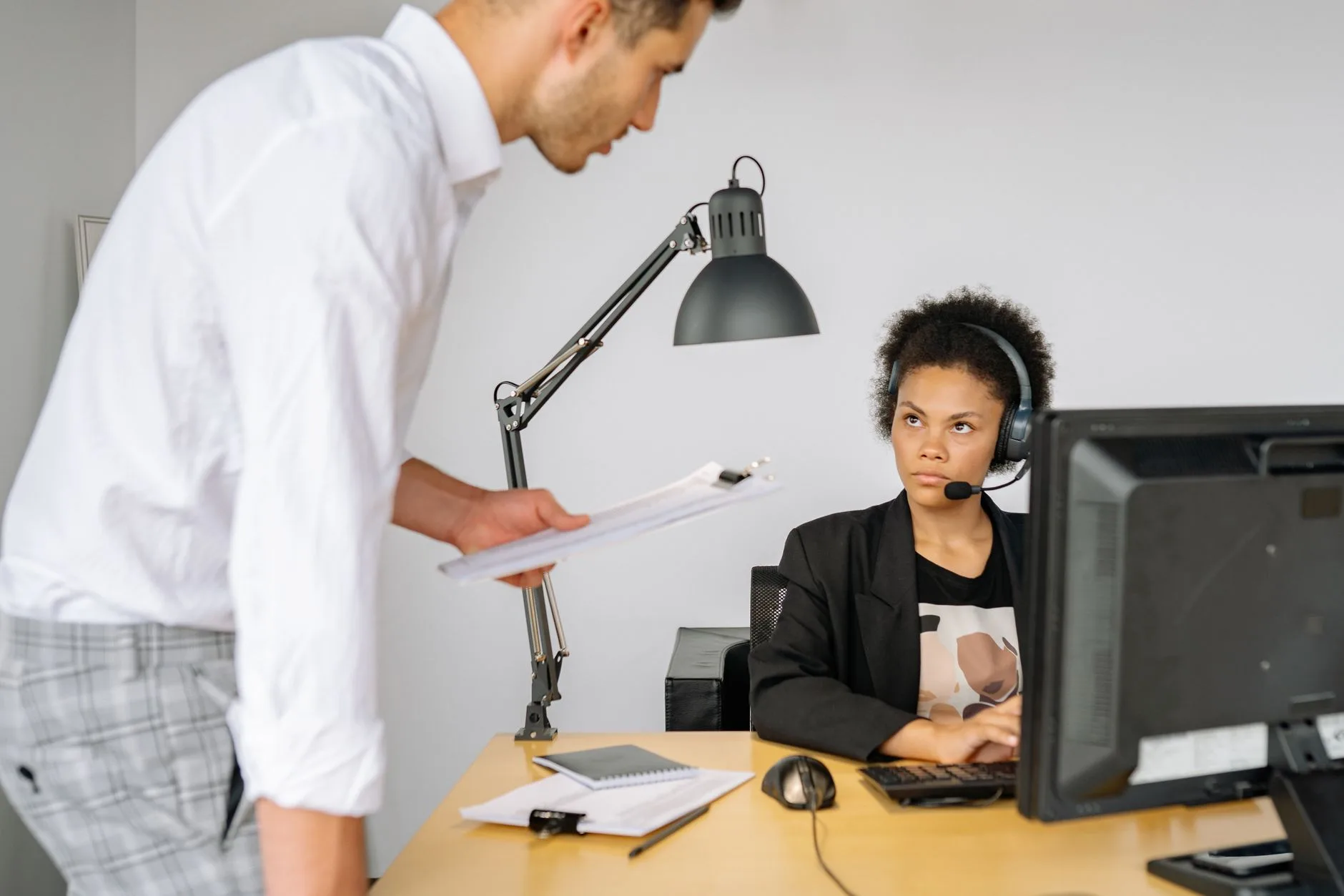 Supervisor checking in with a staff member on a headset call