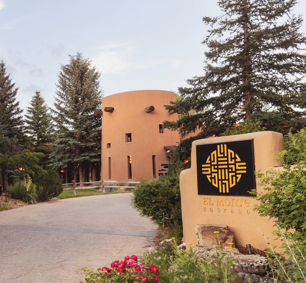 Driveway leading up to exterior of El Monte Sagrado with snow