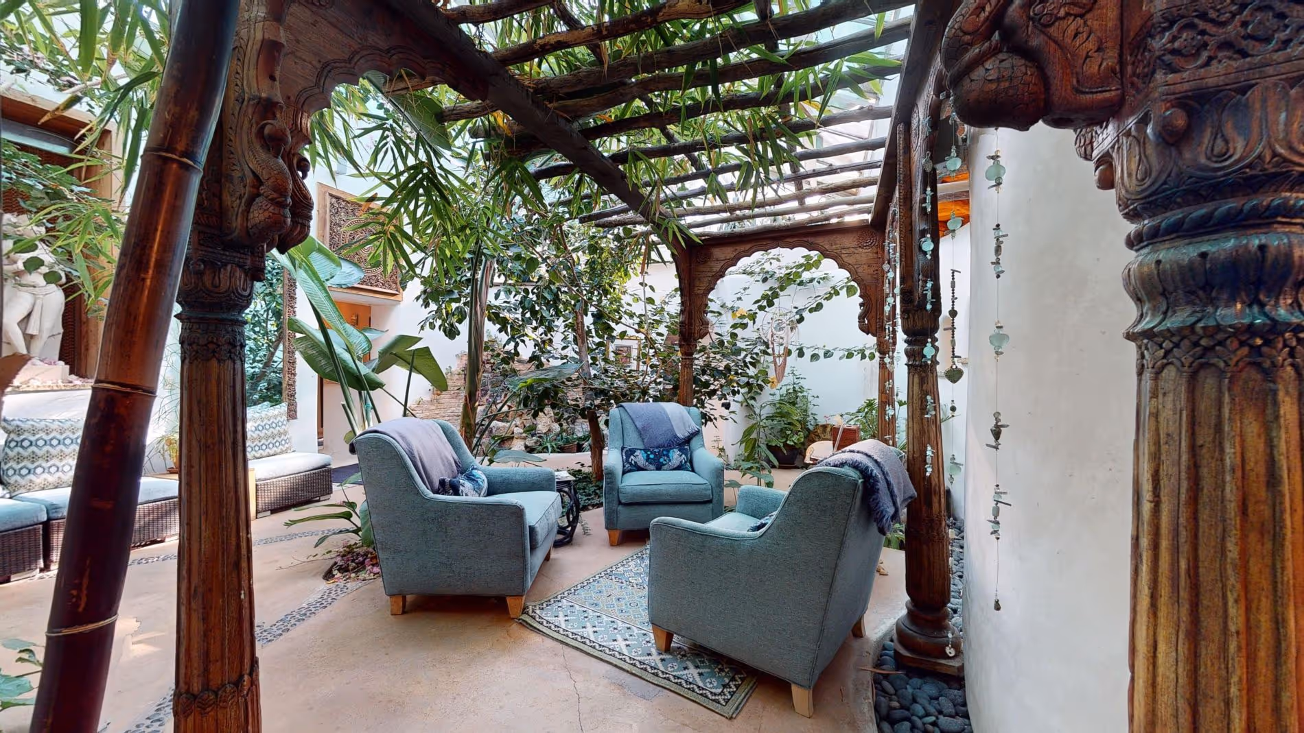 Spa atrium with blue chairs and plants
