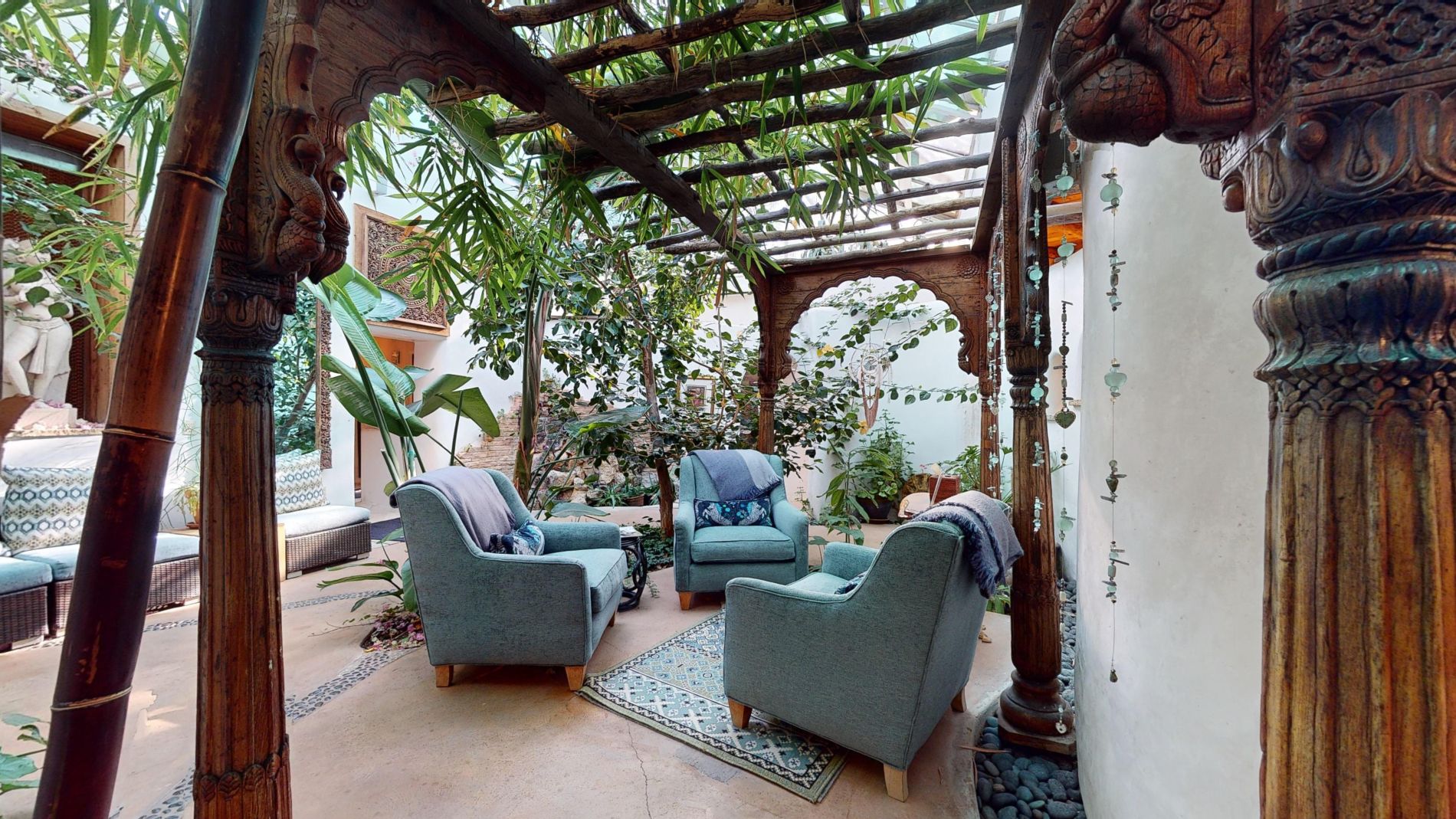 Spa atrium with blue chairs and plants