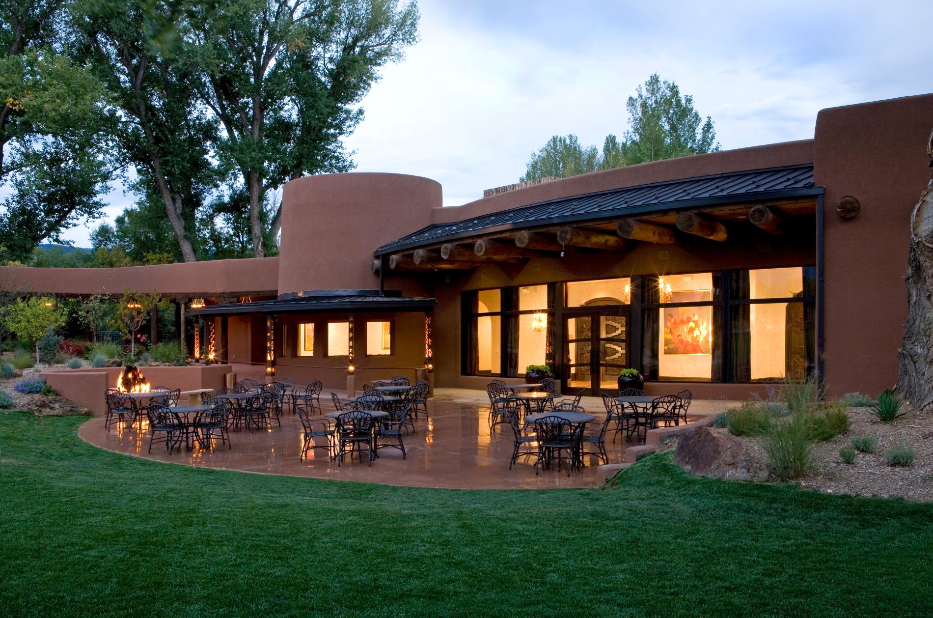 Lawn and patio in front of building at El Monte Sagrado